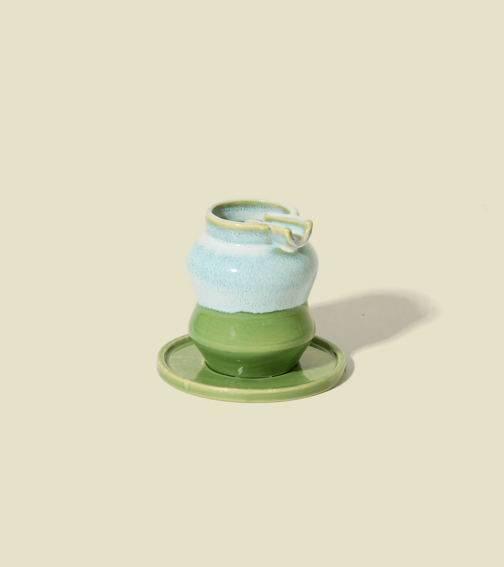 The Mini Ashtray by Seth 3.0 in Foam, pale blue over green, on its plate