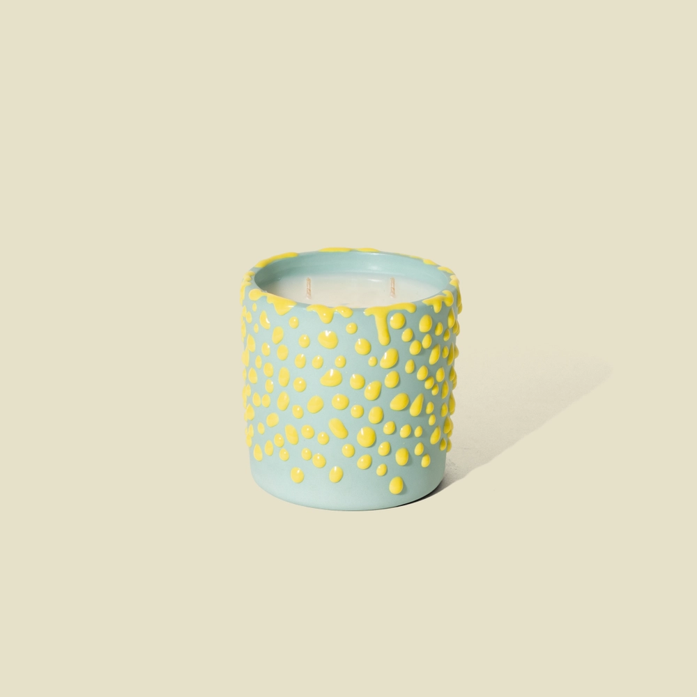 The Gloopy Candle in Wave: pale blue vessel with yellow gloops