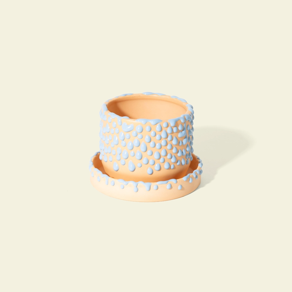 The Small Gloopy Planter in peach with blue gloops